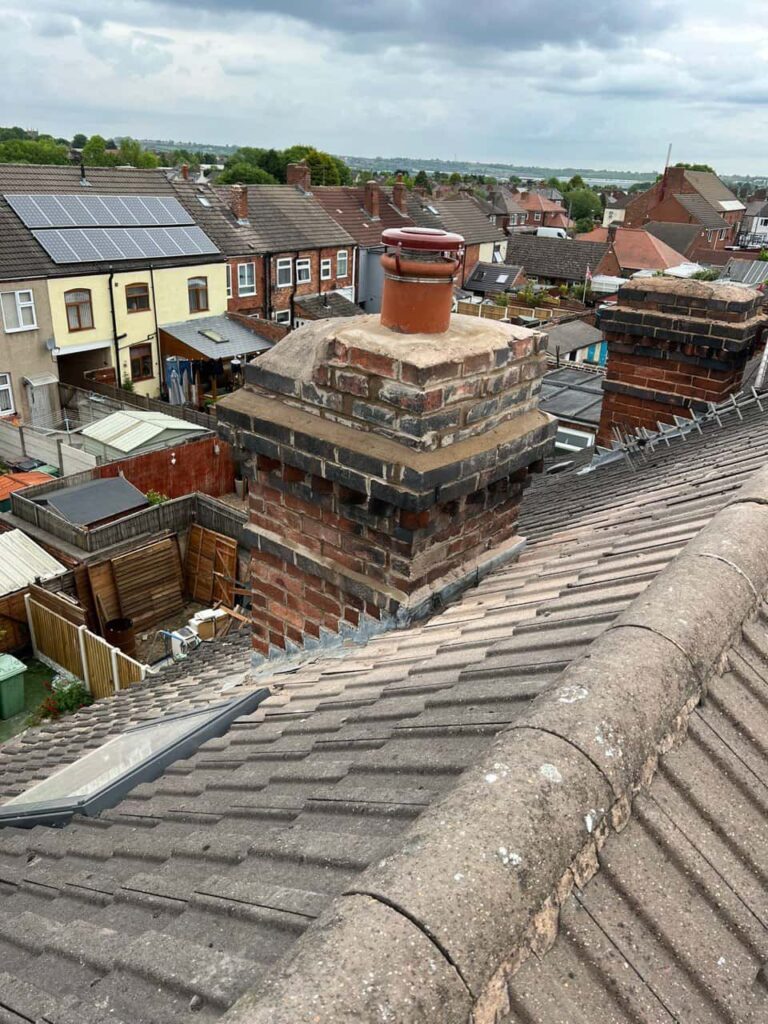 This is a photo taken from a roof which is being repaired by Fulbourn Roofing Repairs, it shows a street of houses, and their roofs